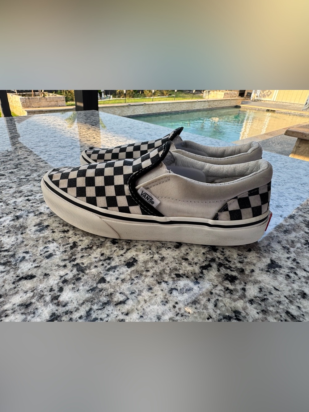 Vans Black & White Checkerboard Slip-On Sneakers